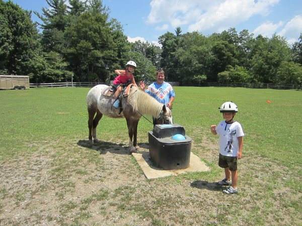 Grandpa leading horse to water during the ring ride.